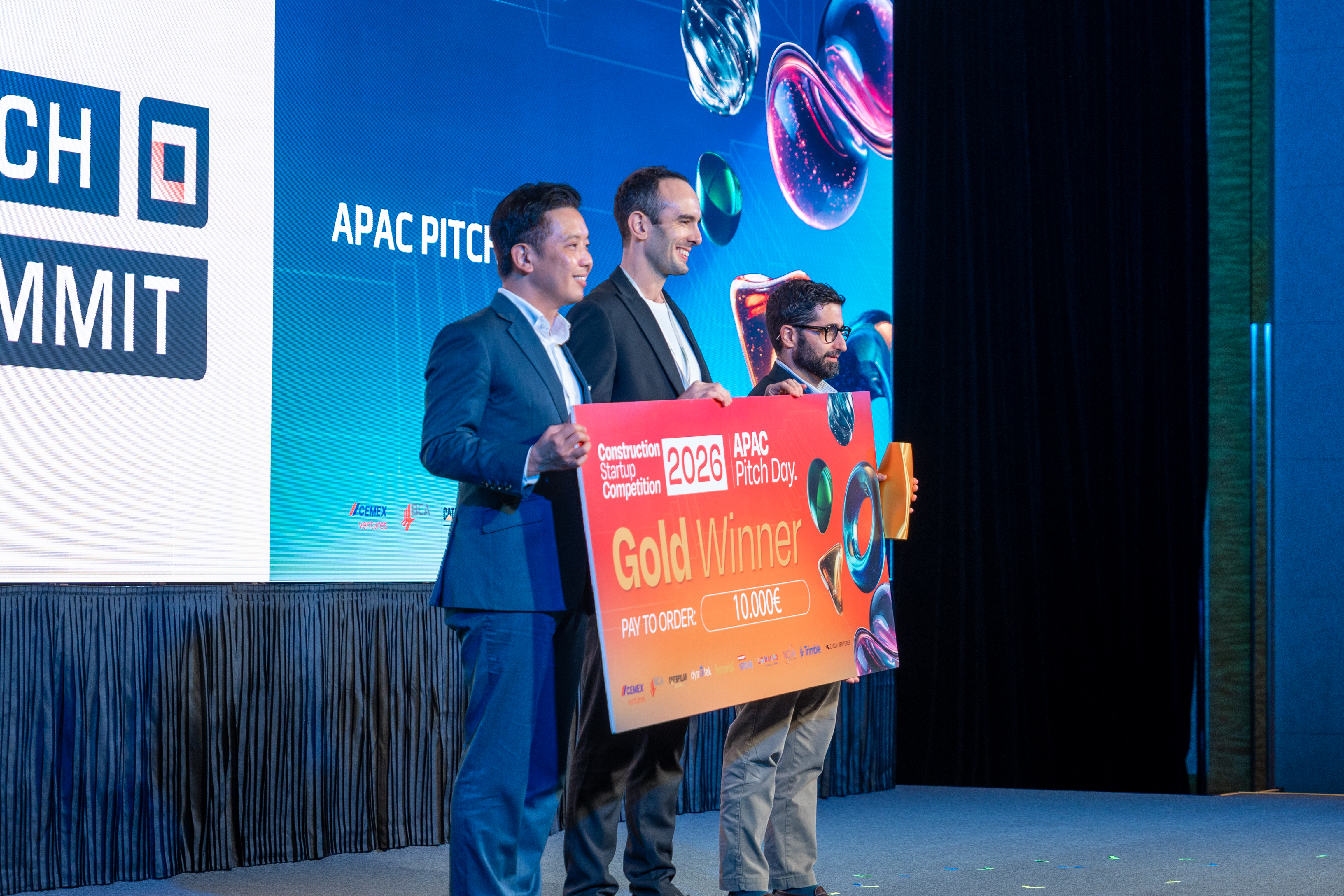 The Civils.ai team receiving the Gold Winner cheque at the Construction Startup Competition 2026 APAC Pitch Day in Singapore