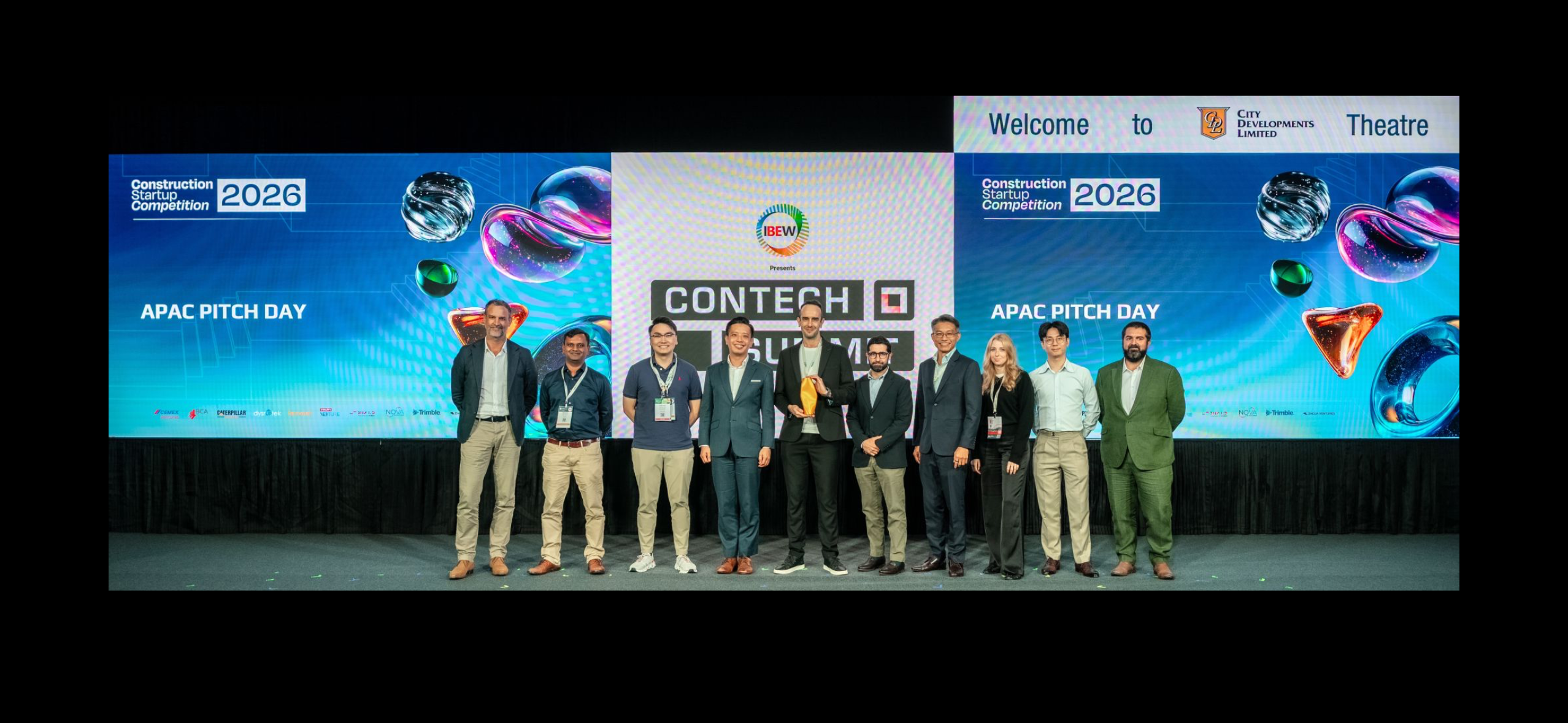 Finalists, jury members and organisers of the Construction Startup Competition 2026 APAC Pitch Day on stage in Singapore