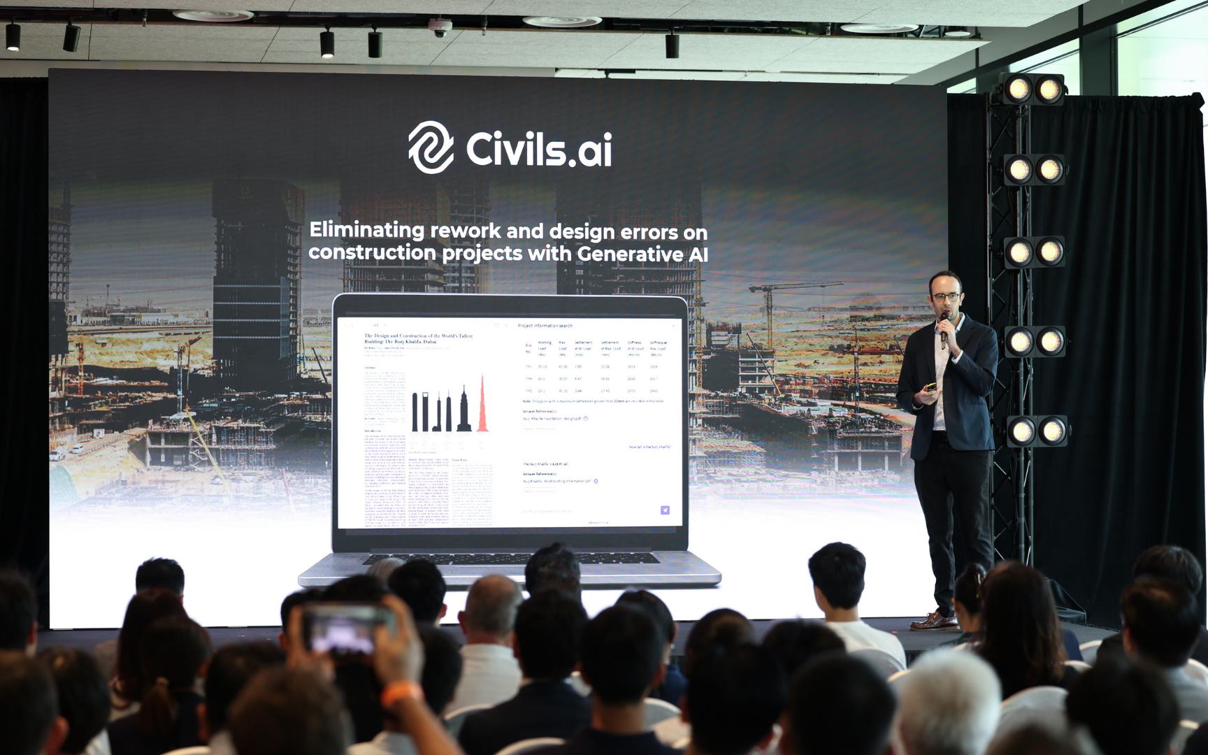 Presenter on stage introducing Civils.ai to the JTC Analytics Day audience