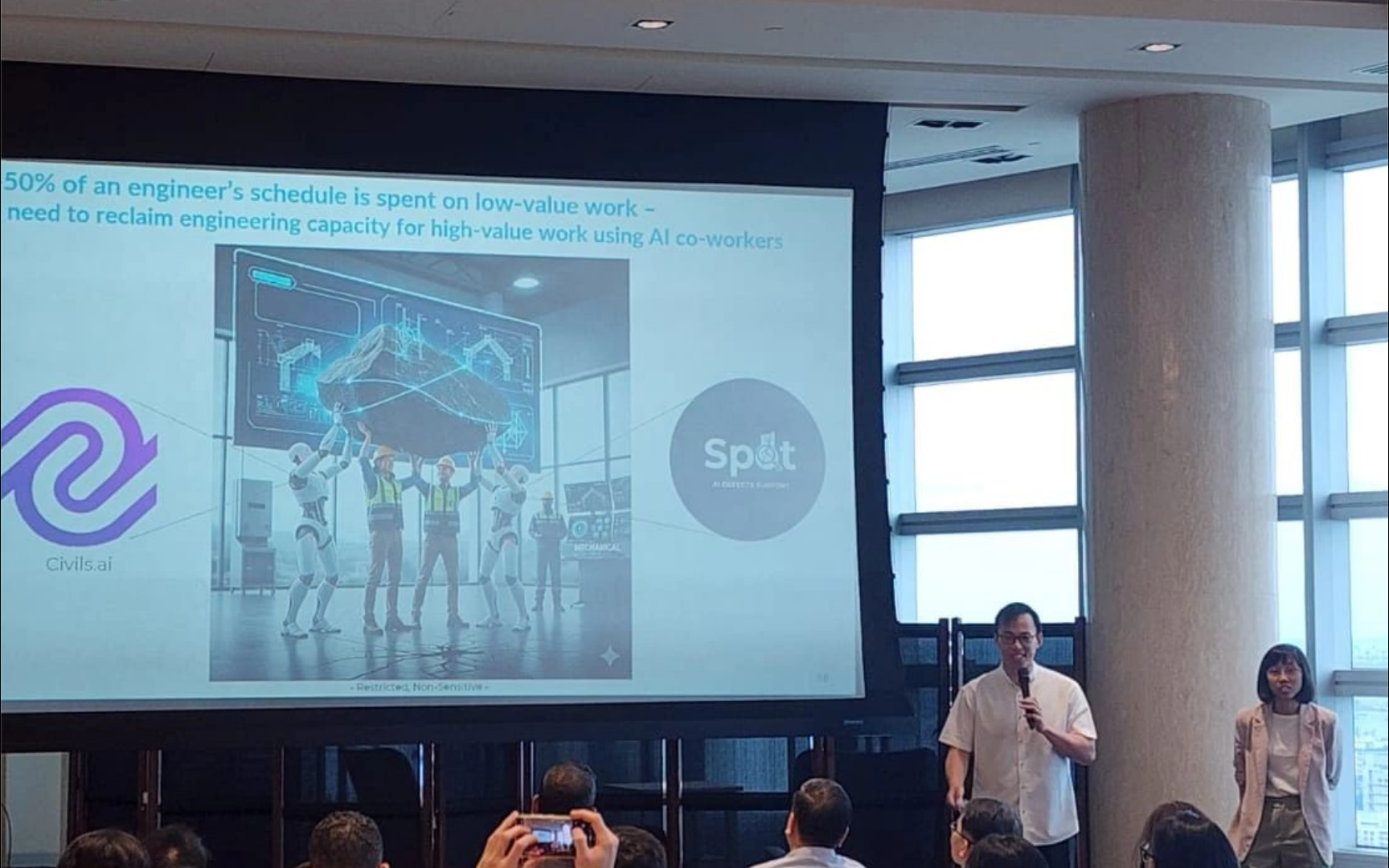 Presenter showing the Civils.ai and Spot AI co-worker slide